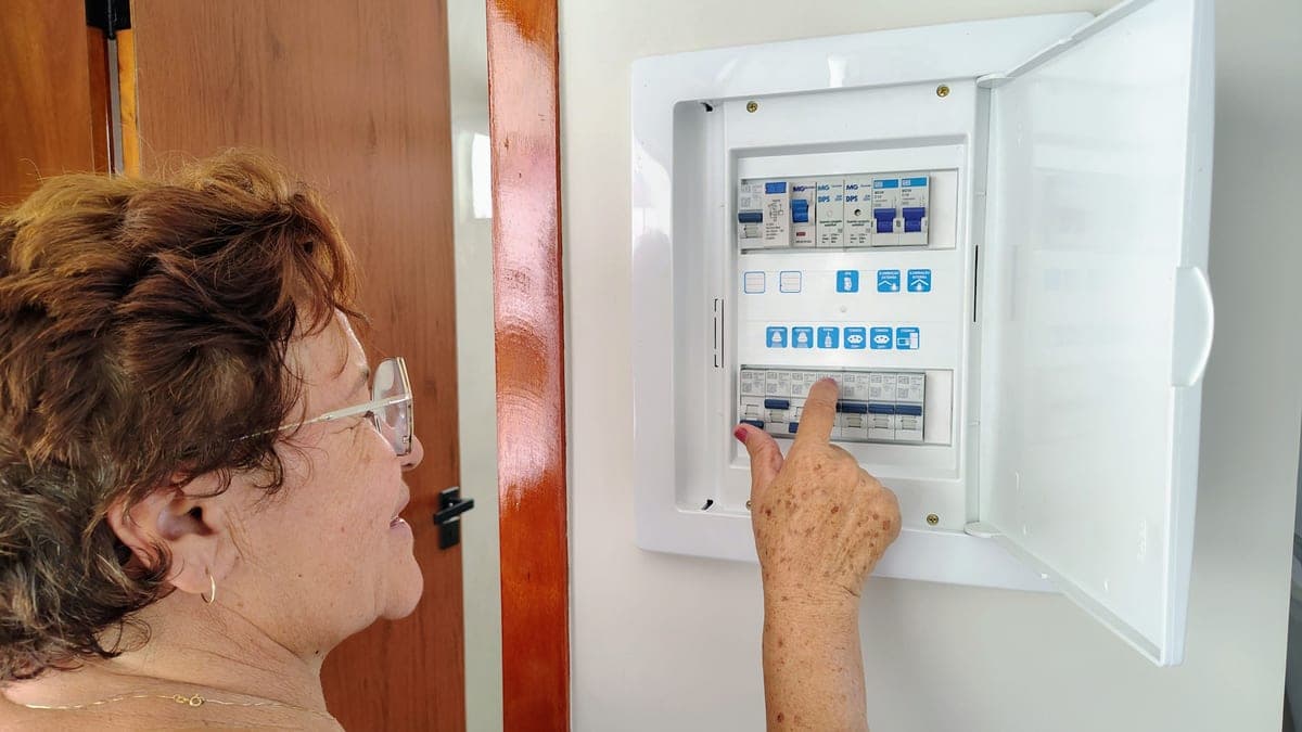 An open residential electrical panel showing circuit breakers