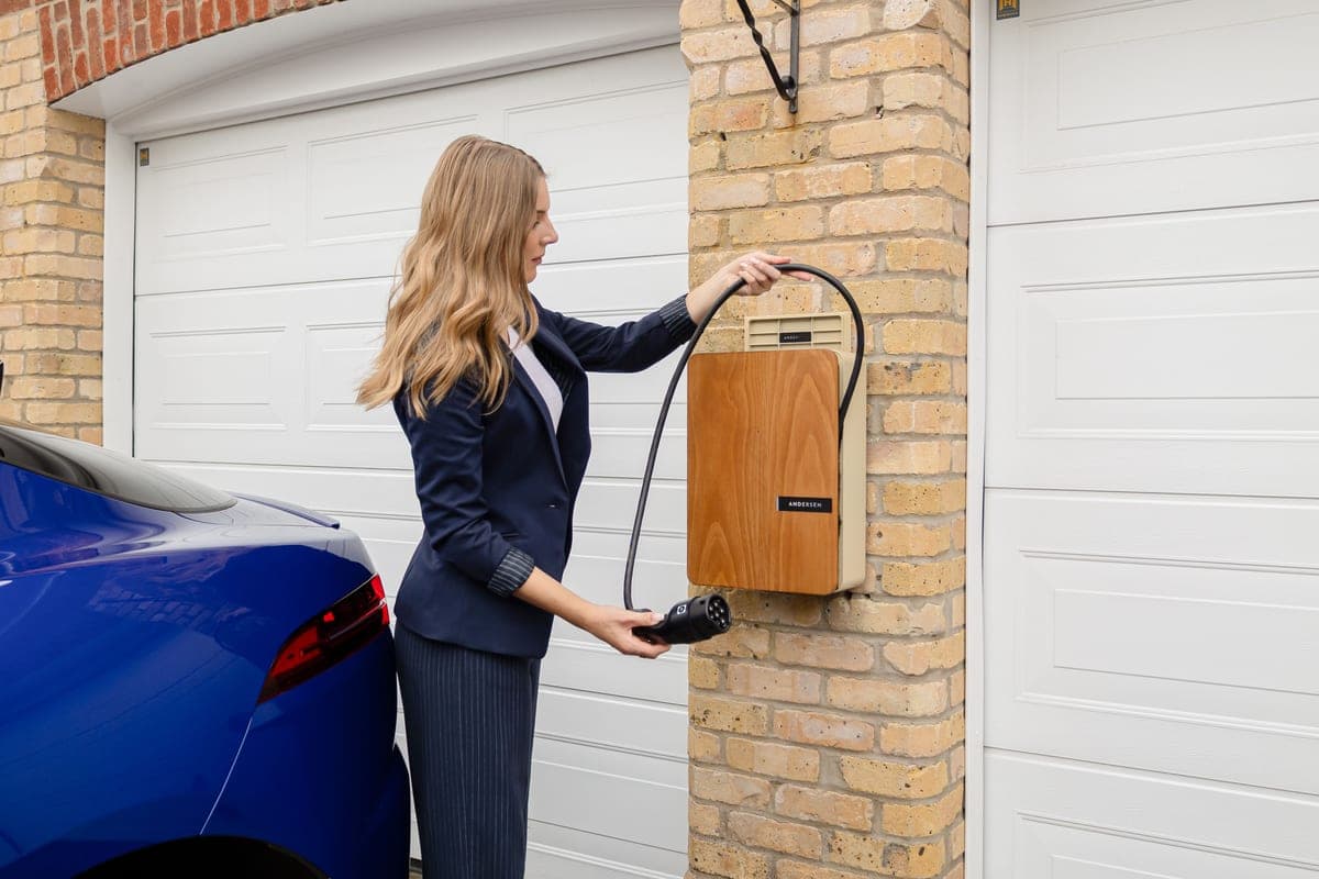 A Level 2 EV charger mounted on a home garage wall